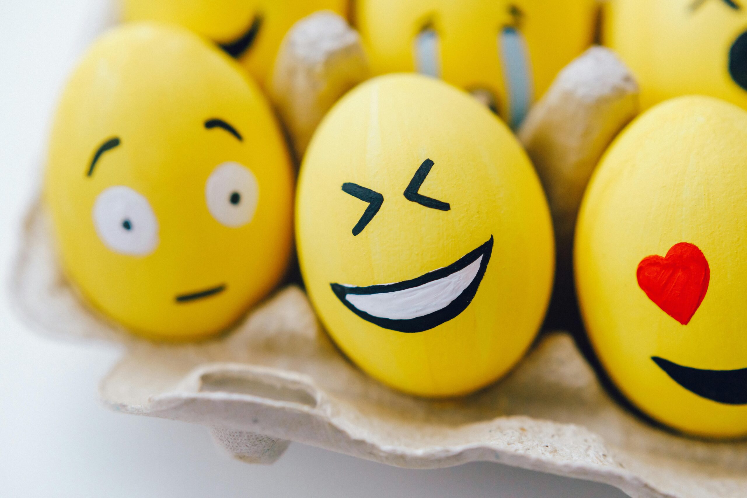 yellow egg with painted laughing face